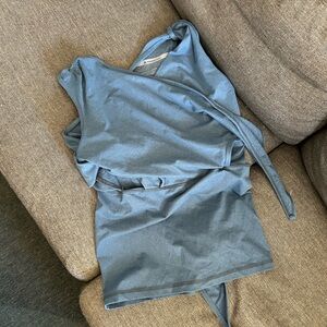 Nesting Days newborn baby wearing top